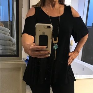 Black shirt with arm hole cut outs